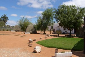CAMPSITE WITH TENTS IN BACKGROUND
